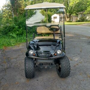 Customized black golf cart with premium wheels and accessories from Flamingo Custom Carts in Atlanta.
