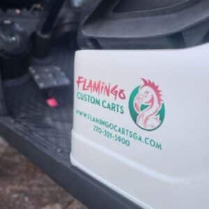 Flamingo Custom Carts logo on customized golf cart body.