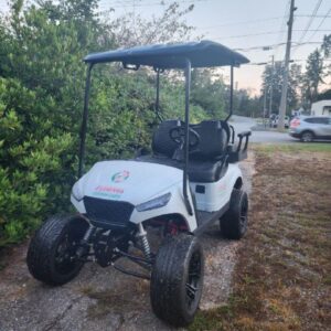 Custom golf cart build by Flamingo Custom Carts, white and black personalized vehicle