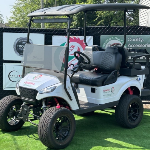 Custom 4-passenger golf cart with white exterior, black and red accents, and Flamingo Carts branding.